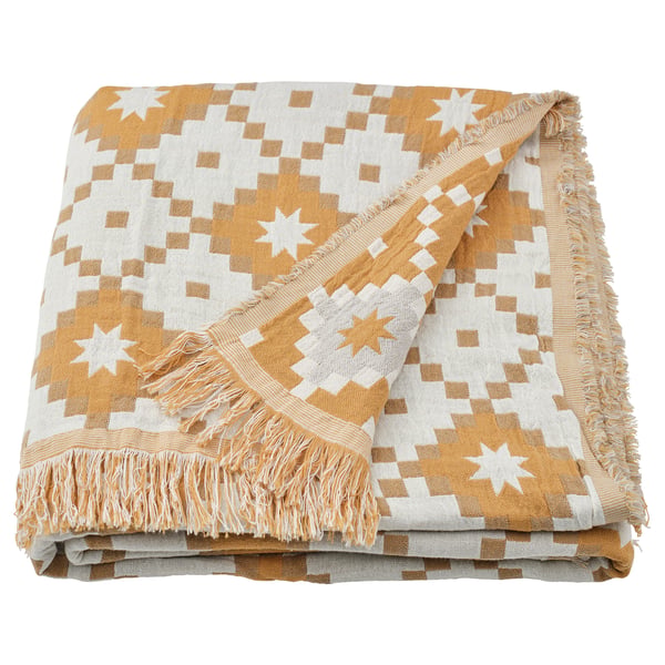 Yellow-white woven throw with fringe, geometric pattern, rectangular shape.