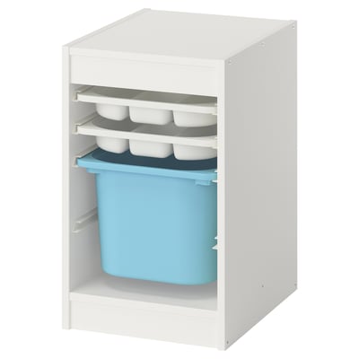 A white TROFAST storage unit with open shelves. It blue and grey plastic trays and containers.
