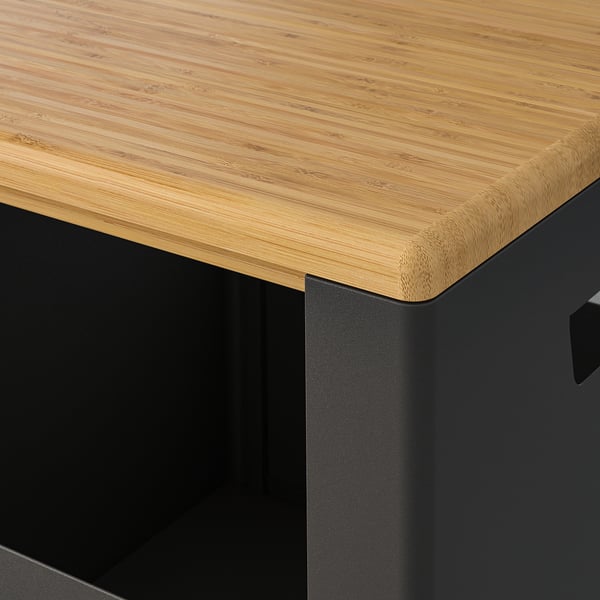 Close-up of TROTTEN bamboo-topped storage. Smooth, durable wood and sleek black metal base.