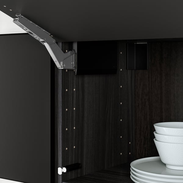 Black cabinet hinge allows drawer front to create horizontal door, push to open, soft close.