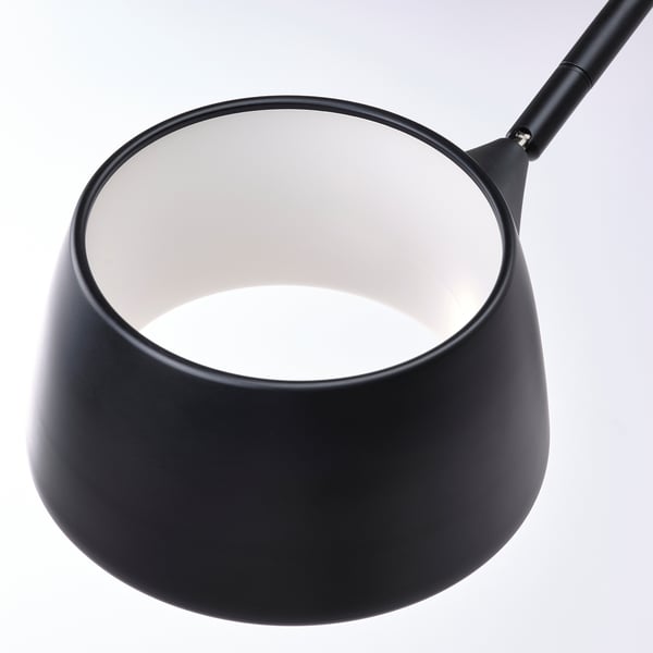 Modern black pendant lamp with adjustable neck, emits soft light.