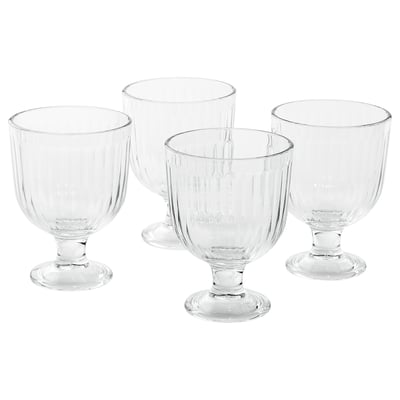 Four clear, ribbed, stackable VARDAGEN glasses made from tempered glass.