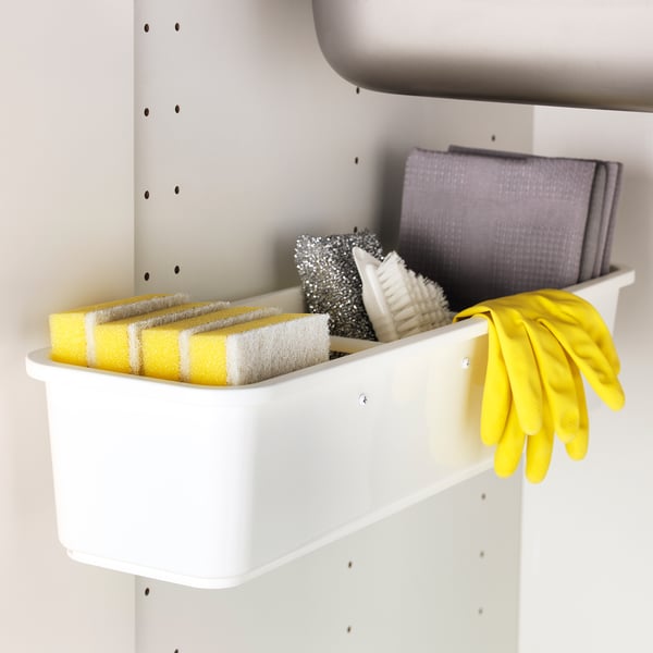 A VARIERA storage container holding yellow sponges, a scrub brush, and yellow gloves, neatly organised for easy access.