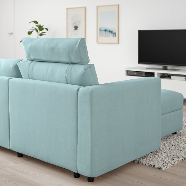 Light blue VIMLE sofa, modern design, cosy & adjustable, fits well in room with tv & rug.