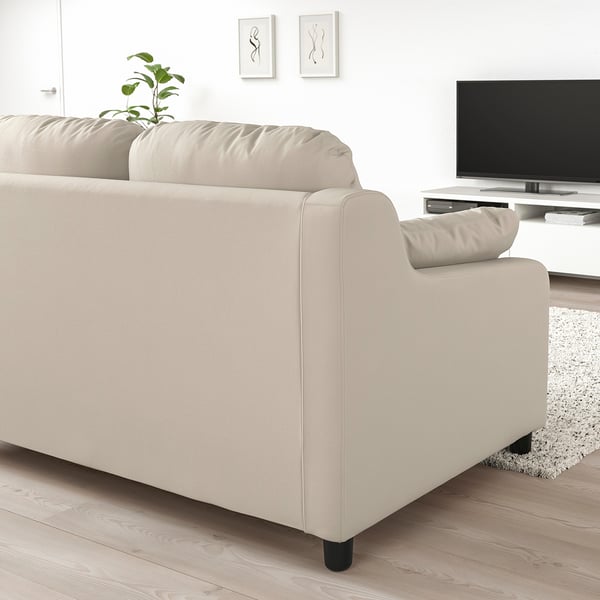 Cosy beige VINLIDEN sofa in living room, large cushions, wide, soft, matches tv and plant.