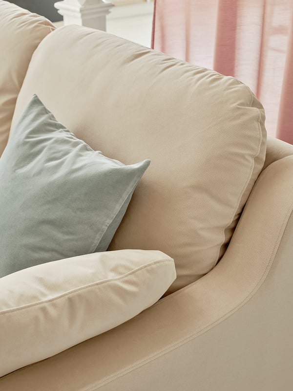 Beige VINLIDEN sofa with soft cushions and light blue pillow.