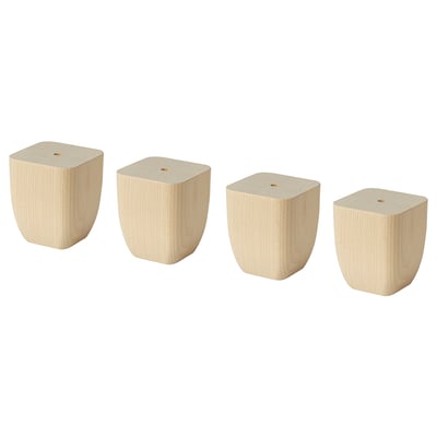 Four light-colored wooden blocks of varying sizes, tapered at the bottom for stability.