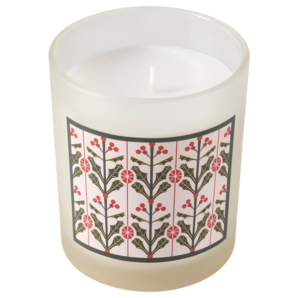 VINTERFINT white scented candle with red holly berry design, made of glass and plant-based wax. Cylindrical shape with a festive pattern.