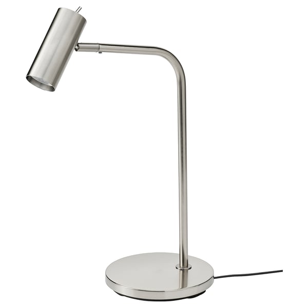 A VIRRMO table lamp in nickel finish with a round base and adjustable arm. Its sleek, minimal design makes it perfect for reading.