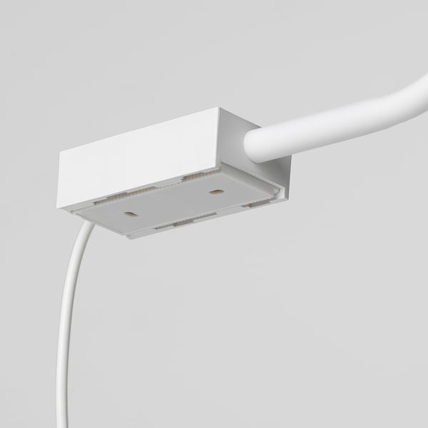 Minimalist wall lamp with adjustable gooseneck, mounted on a white junction box. Elegant and robust design for precision lighting.