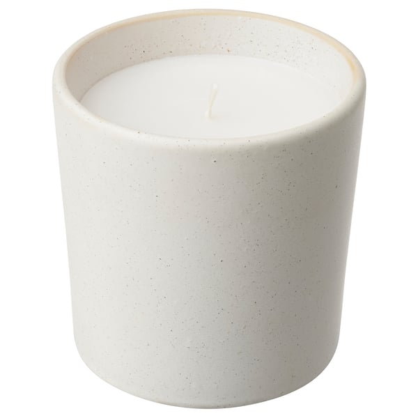 White ceramic candle in round, textured jar with a single wick, perfect for home decor.