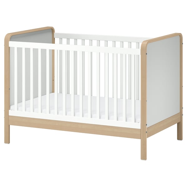 Ikea ÄLSKVÄRD cot, light beige & white, wood & acrylic paint, rectangular design with removable side panel.