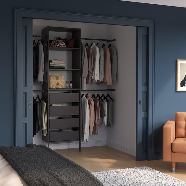 Modern closet with AURDAL system. Grey units organise clothes, sleek design.