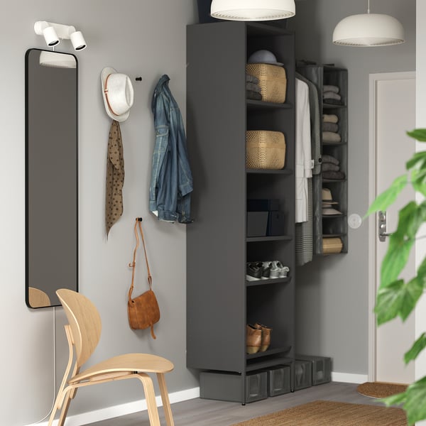 Dark AURDAL storage system with shelves, baskets, and mirror.