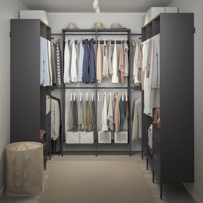 Modern closet organiser with clothes, shelves, and storage bins, ideal for small spaces.