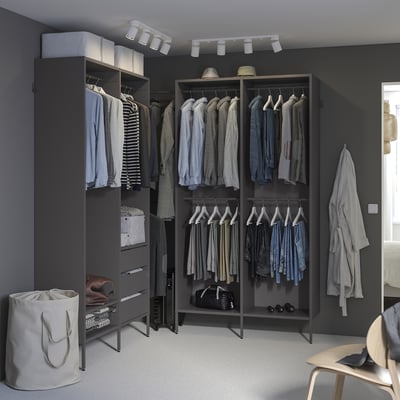 Grey closet organiser with shelves, drawers, hanging space, and top storage for hats and bags.