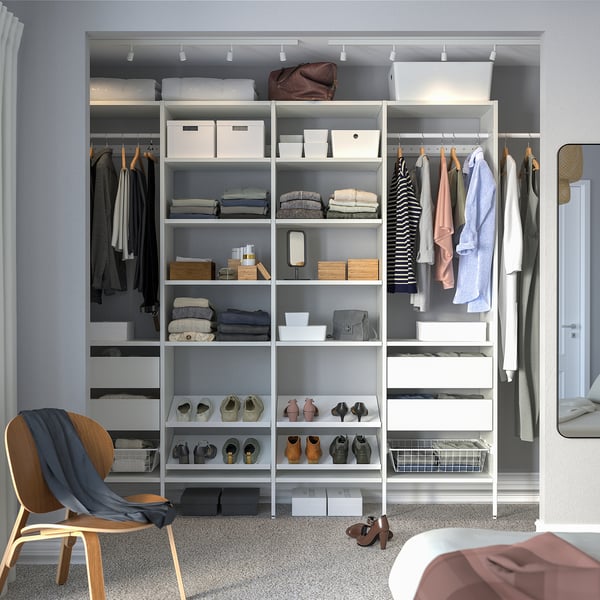 White closet system with shelves, drawers, and hanging space, fitting small spaces, adjustable.