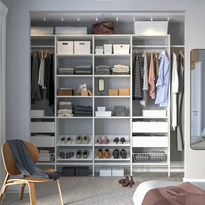 White closet system with shelves, drawers, and hanging space, fitting small spaces, adjustable.