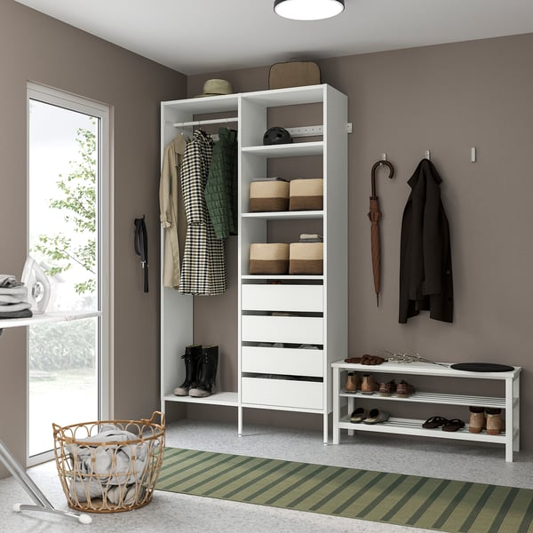 Organised mudroom with white AURDAL storage unit. Holds baskets, boots, and coats. Perfect for small spaces.
