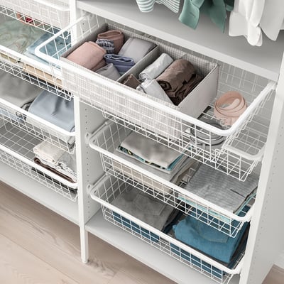 Wire storage baskets in white; neatly organises folded clothes, providing open access. Used in AURDAL closet system for efficient use of space.