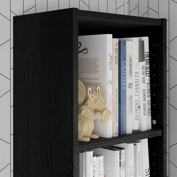 Black bookshelf with wooden toy and books, maximising vertical storage.