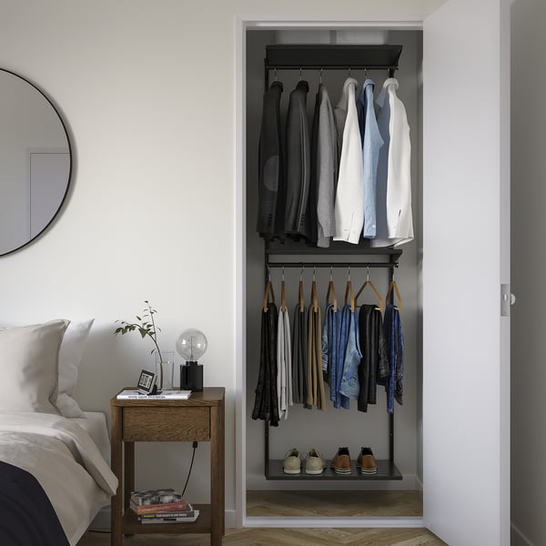 BOAXEL dark grey wall-mounted closet with shelves & hangers fits narrow space next to bed.