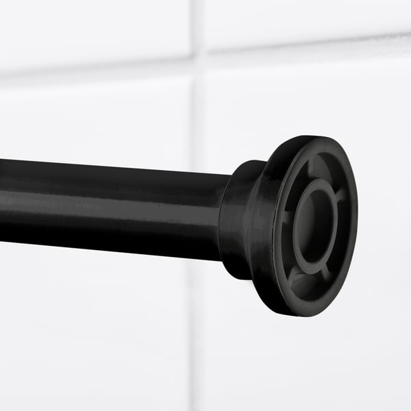 Black shower curtain rod close-up, showing adjustable metal rod and plastic cap, highlighting its sleek design and sturdy construction.