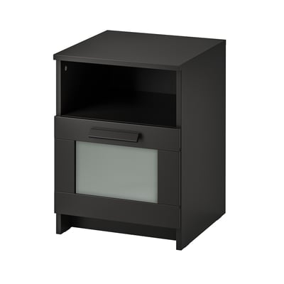 A black BRIMNES bedside table with a top shelf, drawer, and tempered glass front.