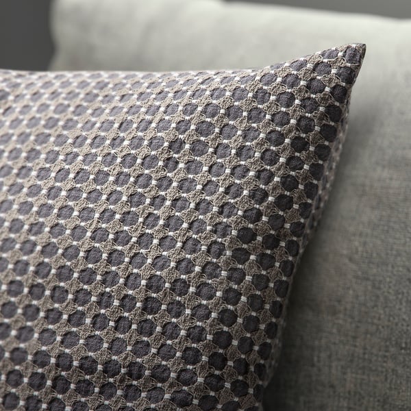 Decorative cushion cover with intricate dobby-weave pattern, soft cotton feel.