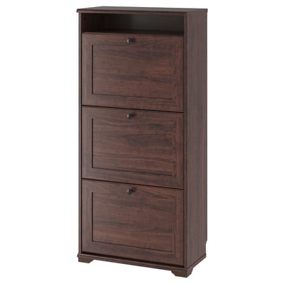 BRUSALI tall brown wooden shoe cabinet with three compartments and dark handles.