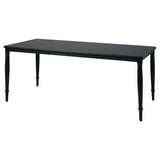 Black rectangular dining table with four tapered legs, made of steel and lacquered mdf.