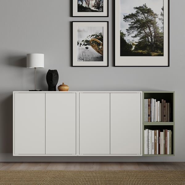 Modern living room with EKET cabinet, lamp, green bookshelf, and nature photos.