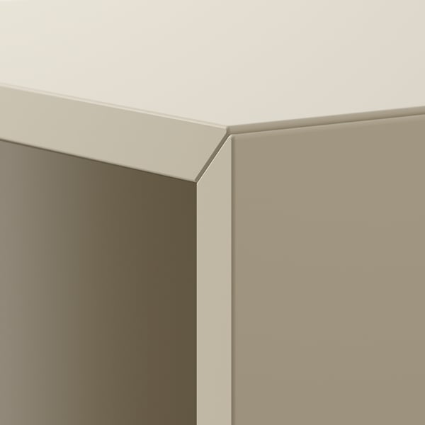 Close-up of sleek, white wall-mounted cabinet corner, showcasing smooth finish and modern design.