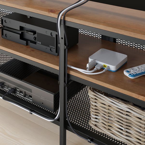 Wooden tv stand with mesh doors, showcasing organised electronics and open-back design for signal management.