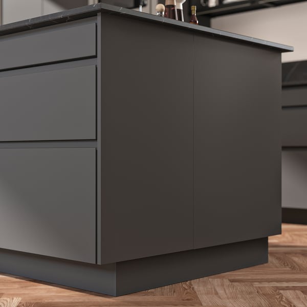 Modern black kitchen island with drawers and countertop. Clean, minimalist design.