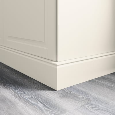 White cabinet base with plinth covering floor gap, part of kitchen decor.