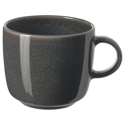 A sleek, dark grey GLADELIG mug with a smooth, curved handle and glossy finish. Made of stoneware, it a simple, elegant design.