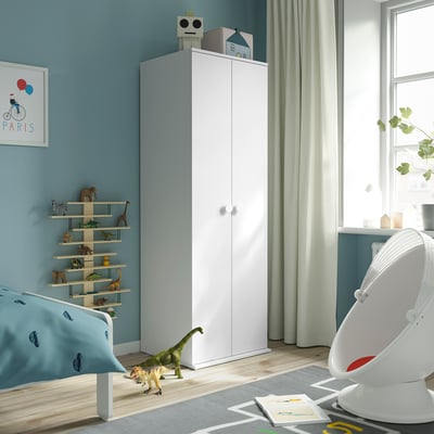 Kids room with tall white GODISHUS wardrobe, storing clothes and toys.