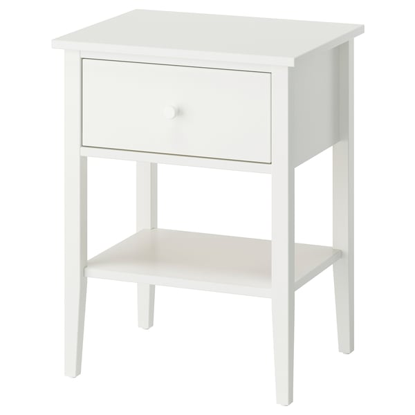 A white GULLABERG bedside table with a single drawer and an open shelf. It clean lines and elegant details, made of acrylic paint and fibreboard.