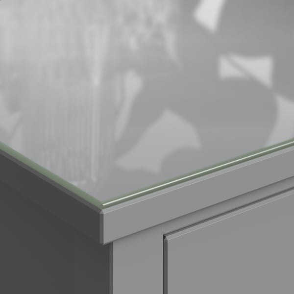 Glass-topped GULLABERG chest, sleek and modern, with clean lines and grey drawers.