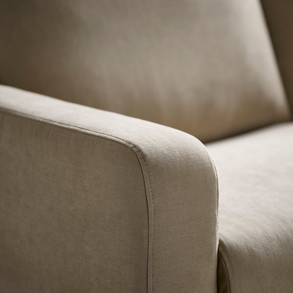 Close-up of a GULLVALLA sofas armrest, showcasing its soft, textured fabric and comfortable, rounded shape.