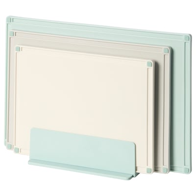 GUMMIHAJ chopping boards in light colours with a holder. They are rectangular with non-slip sides, ideal for kitchen use.