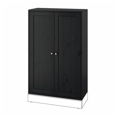 Dark brown HAVSTA wooden cabinet, rectangular, with two doors and circular knobs.