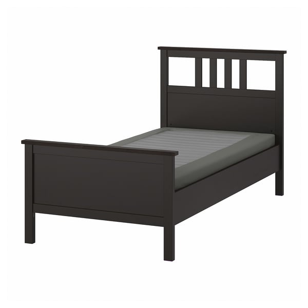 Black HEMNES bed with grey mattress, modern design.