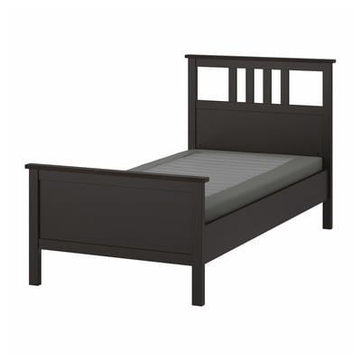 Black HEMNES bed with grey mattress, modern design.