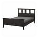 Black HEMNES wooden bed with high headboard, slatted design, adjustable sides, sturdy frame.