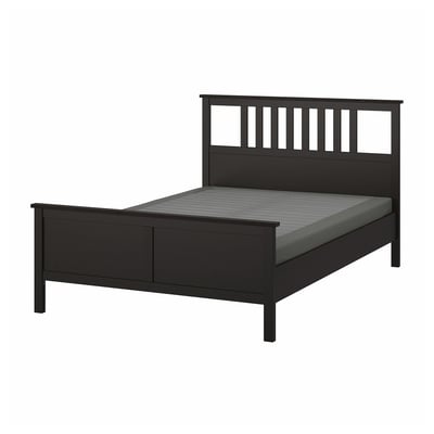 Black HEMNES wooden bed with high headboard, slatted design, adjustable sides, sturdy frame.