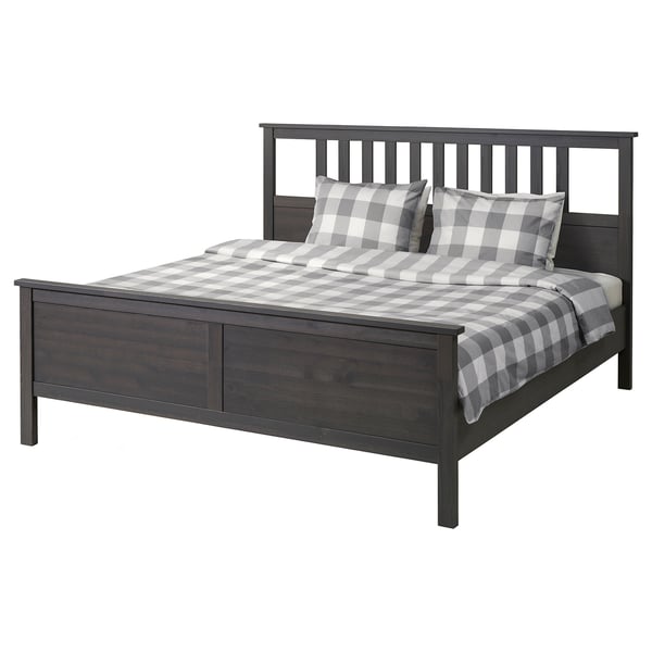 Dark grey HEMNES solid wood bed with crisp plaid bedding.