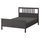 Dark grey HEMNES wooden bed with slatted headboard, simple design.