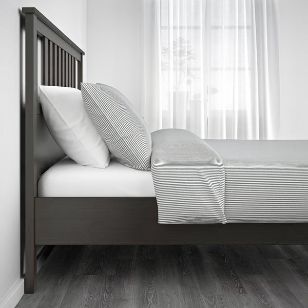 Bed frame with adjustable sides for varied mattress thickness.